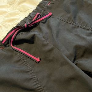 Black scrub top and bottom with pink detail